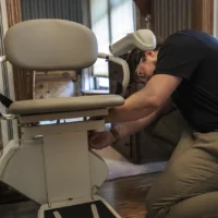 installer working on stair lift