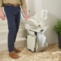 Person operating outdoor stairlift device