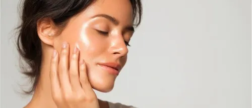 Woman, brunette hair, with eyes closed and glowing skin from better water
