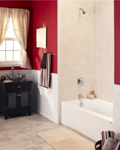 Bathroom with red walls and golden fixtures, tiled flooring
