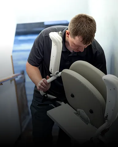 Stair lift being installed in a home