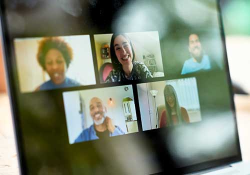 screenshot of a team of employees on a virtual video call