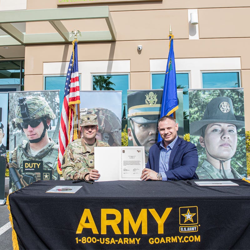 two army veterans displaying a signed letter